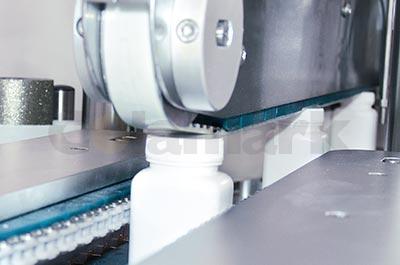 Front Side Labeling System with Re-orientation for Square-wrapping Front Side Labeling System with Re-orientation for Square-wrapping