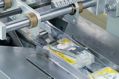 Overwrapping and Labeling System Overwrapping and Labeling System